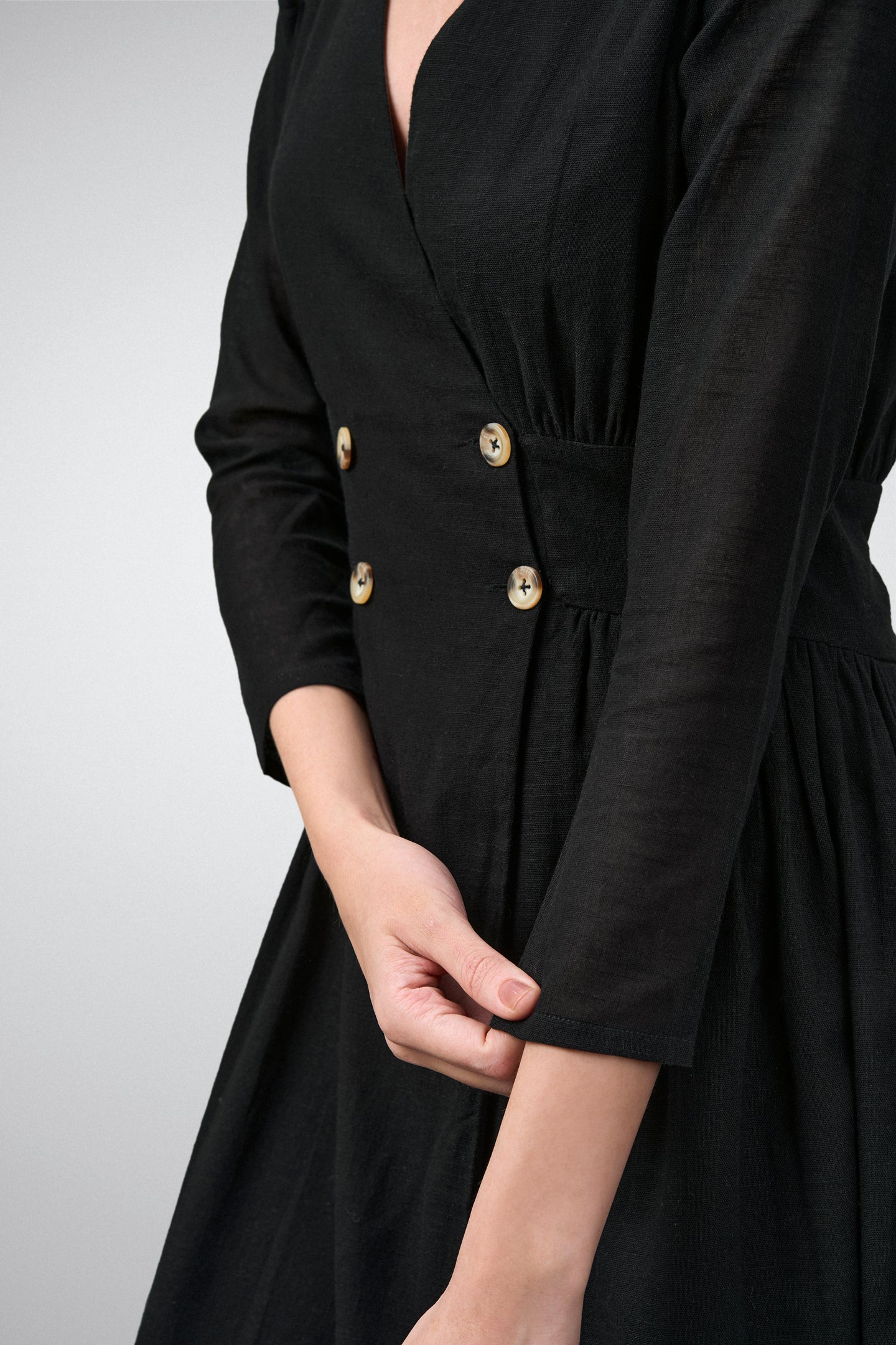 Ladies 100% Cotton Soft And Breathable Long Sleeve V Neckline Fit And Flare Midi Dress For Women Model Fonrt Left Hand Side View | Balck Cotton Fit & Flare Midi Dress For Women