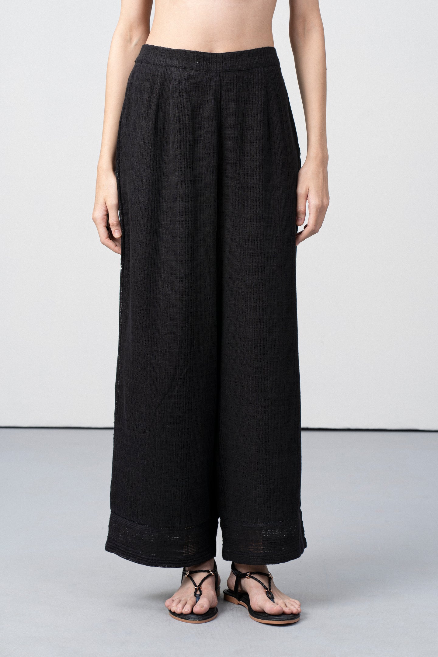 Women Pants 100% Cotton Textured Elastic Waistband Straight Fit Black Color Trousers  | Black Cotton Straight-fit Trousers For Women | Fornt Side View Cotton Guipure Straight Fit Trousers