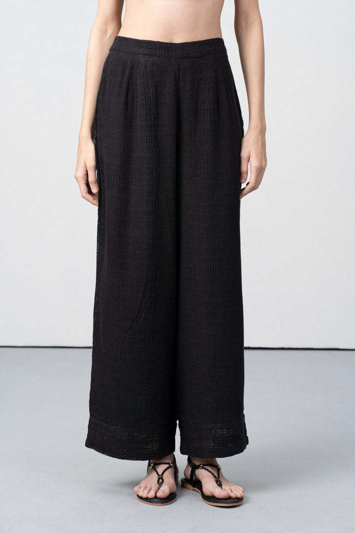 Women Pants 100% Cotton Textured Elastic Waistband Straight Fit Black Color Trousers  | Black Cotton Straight-fit Trousers For Women | Fornt Side View Cotton Guipure Straight Fit Trousers