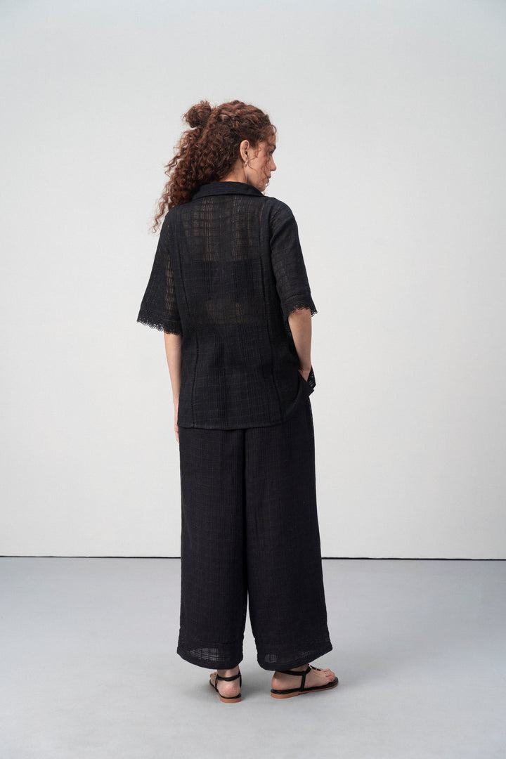 Cotton Black Embroidered Split Neckline Tie Up String Half Sleeve Shirt For Women Ladies for Back Model View | Black Cotton Guipure V-neck Top For Women