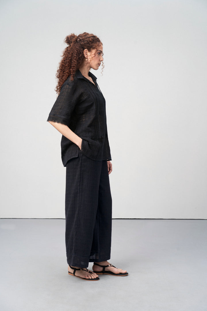 Cotton Black Embroidered Split Neckline Tie Up String Half Sleeve Shirt For Women Ladies for Right Side Model View | Black Cotton Guipure V-neck Top For Women