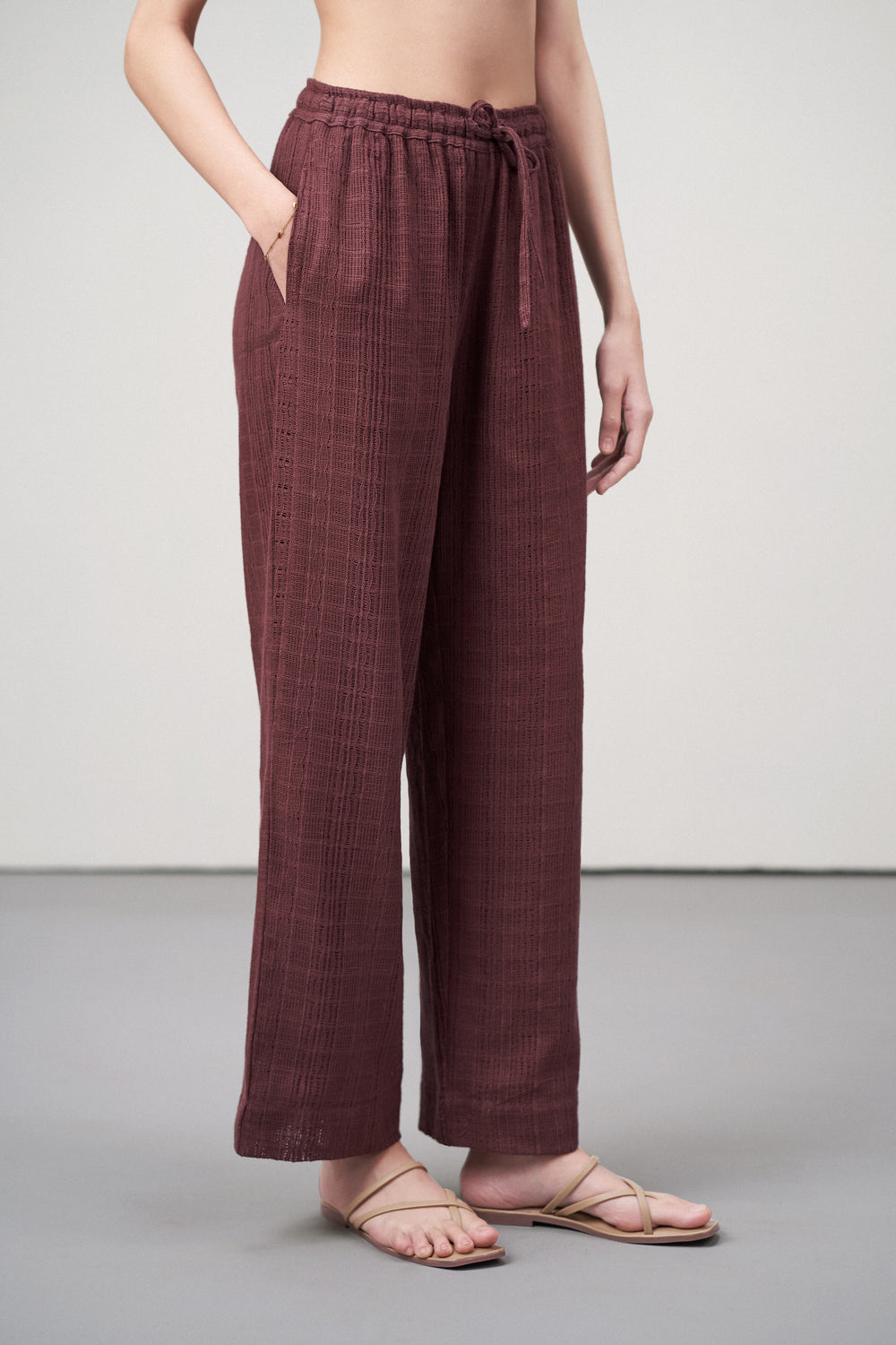 Women Pants Cotton Guipure Textured Straight Fit Elastic Waistband Maroon Trousers Side Pocket View | Deep Rosewood Cotton Straight-fit Trousers For Women | Cotton Guipure Elasticated Waist Trousers