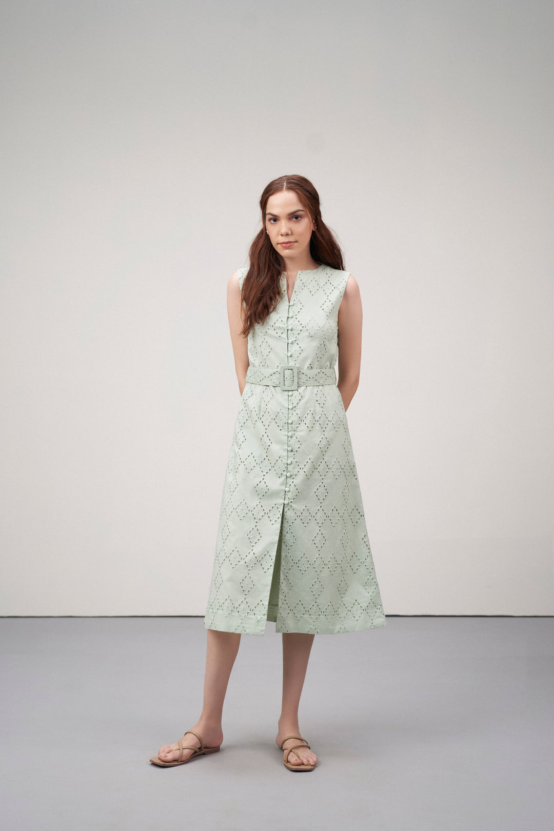 Cotton Embroidered Eyelet Split Neck Sleeveless Fabric Belt Dress For Women Ladies Light Green Color Model Front View | Women's Light Green Cotton Sleeveless Relaxed Fit Eyelet Cutwork Dress