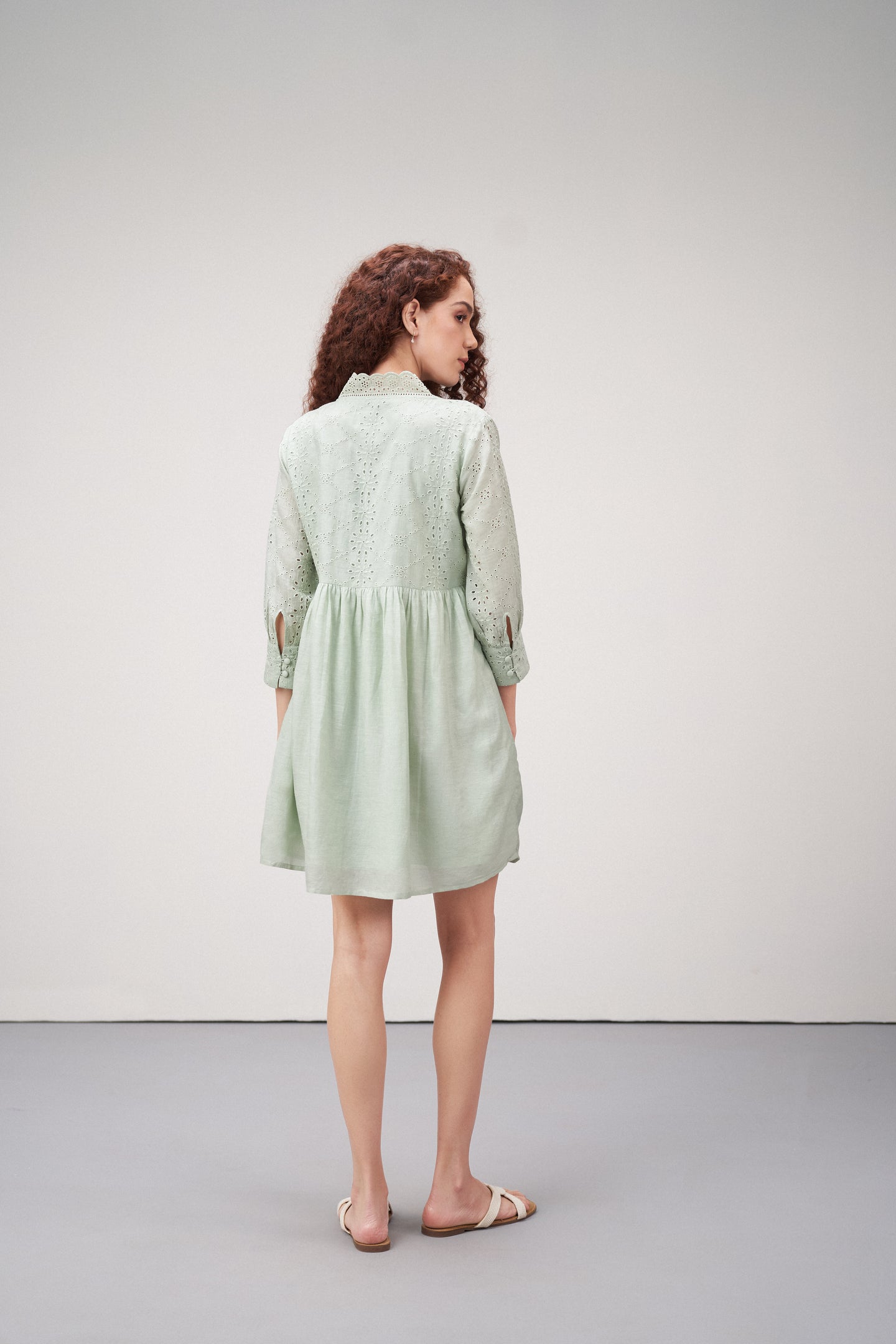Linen Cutwork Embroidery Long Sleeves V Neckline Scalloped Edge Lightweight Mini Short Dress For Women Ladies Light Green Color Back Model View | Women's Premium Linen Cotton Green Embroidered Cutwork V-neck Mini Dress | Broidery Anglaise Short Dress