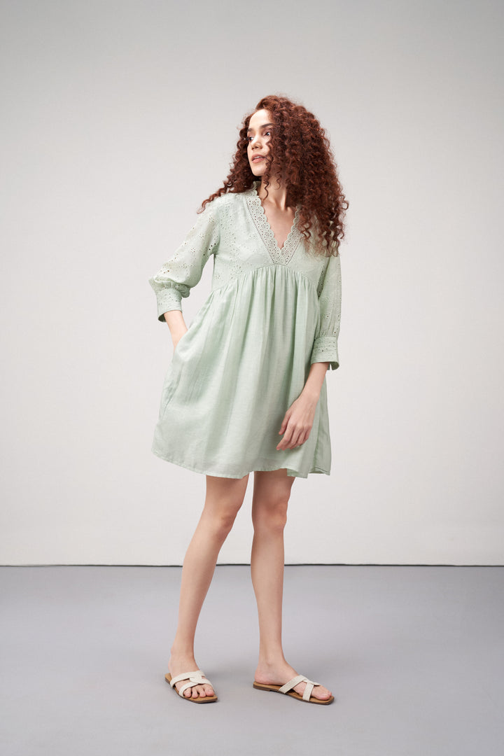 Linen Cutwork Embroidery Long Sleeves V Neckline Scalloped Edge Lightweight Mini Short Dress For Women Ladies Light Green Color Front Model View | Women's Premium Linen Cotton Green Embroidered Cutwork V-neck Mini Dress | Broidery Anglaise Short Dress