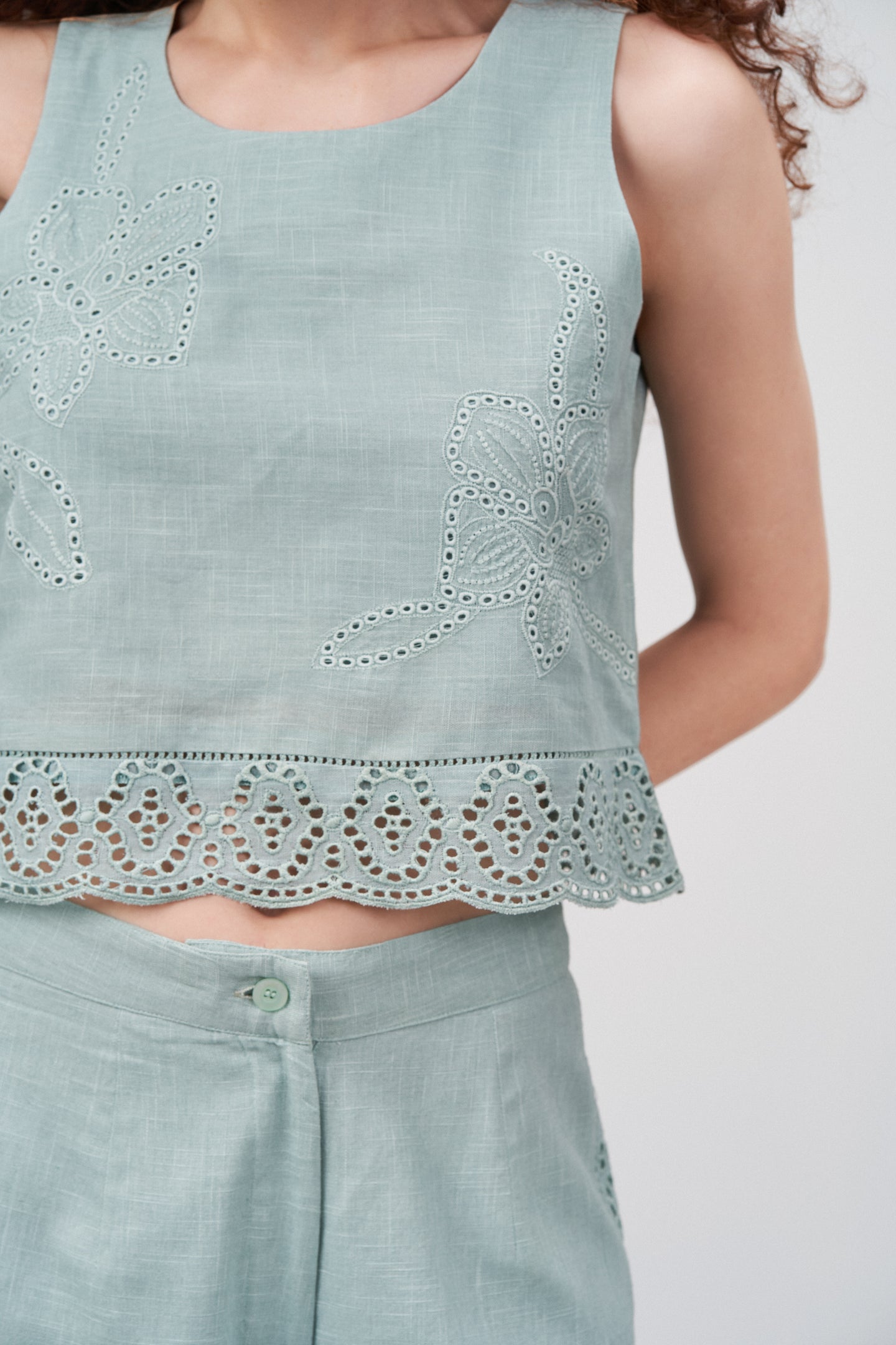 Women Crop Top 100% Cotton Light Green Scalloped Embroidery Lace Hem Sleeveless Top For Ladies Model Front View | Heather Cotton Sleeveless Crop Top With Scalloped Embroidery