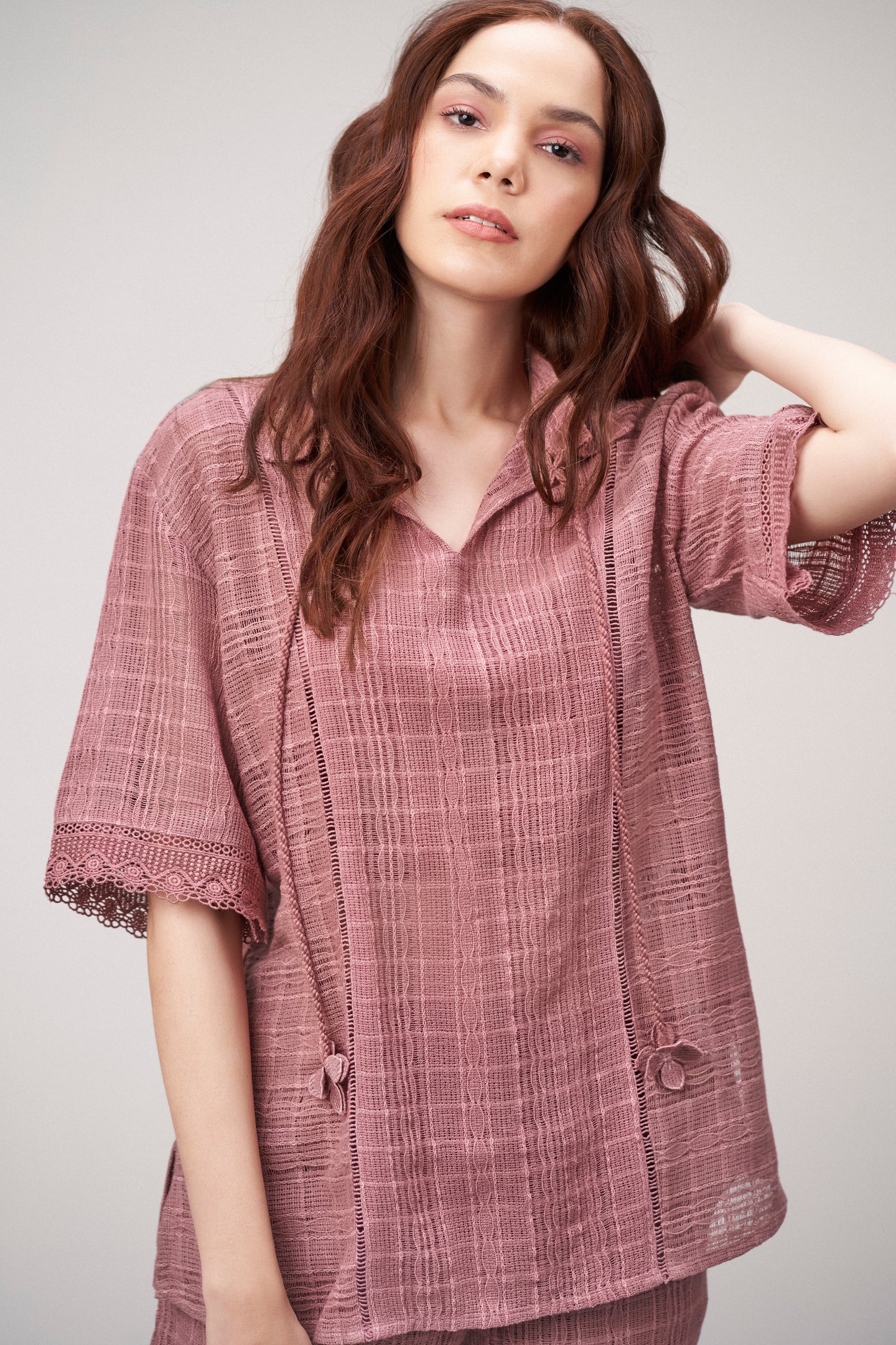 Cotton Pink Embroidered Split Neckline Tie Up String Half Sleeve Shirt For Women Ladies Model Closed up View | Rosy Brown Cotton Guipure V-neck Top For Women