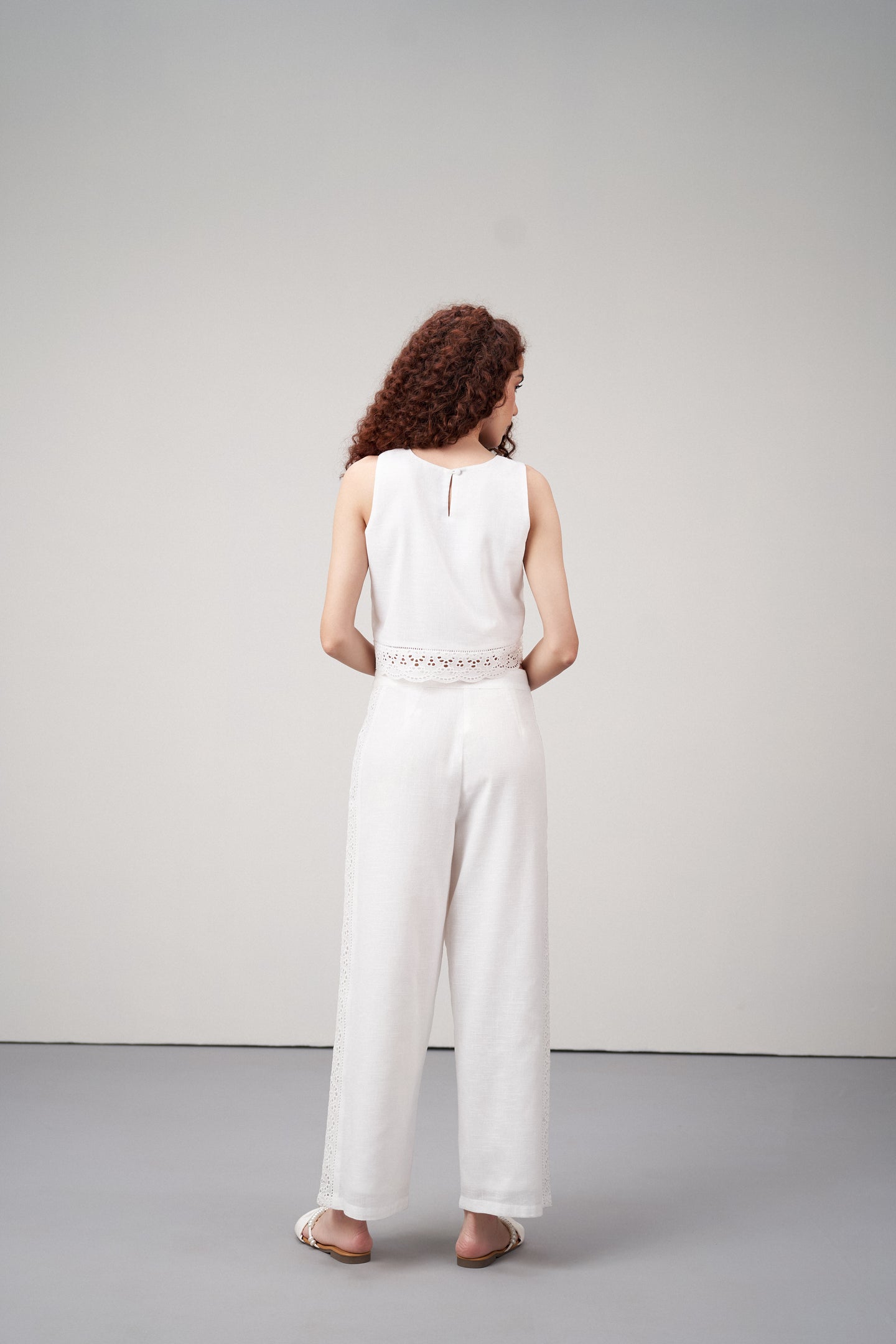 Women Crop Top 100% Cotton White Color Scalloped Embroidery Lace Hem Sleeveless Crop Top For Ladies Model Back View | White Cotton Sleeveless Crop Top With Scalloped Embroidery