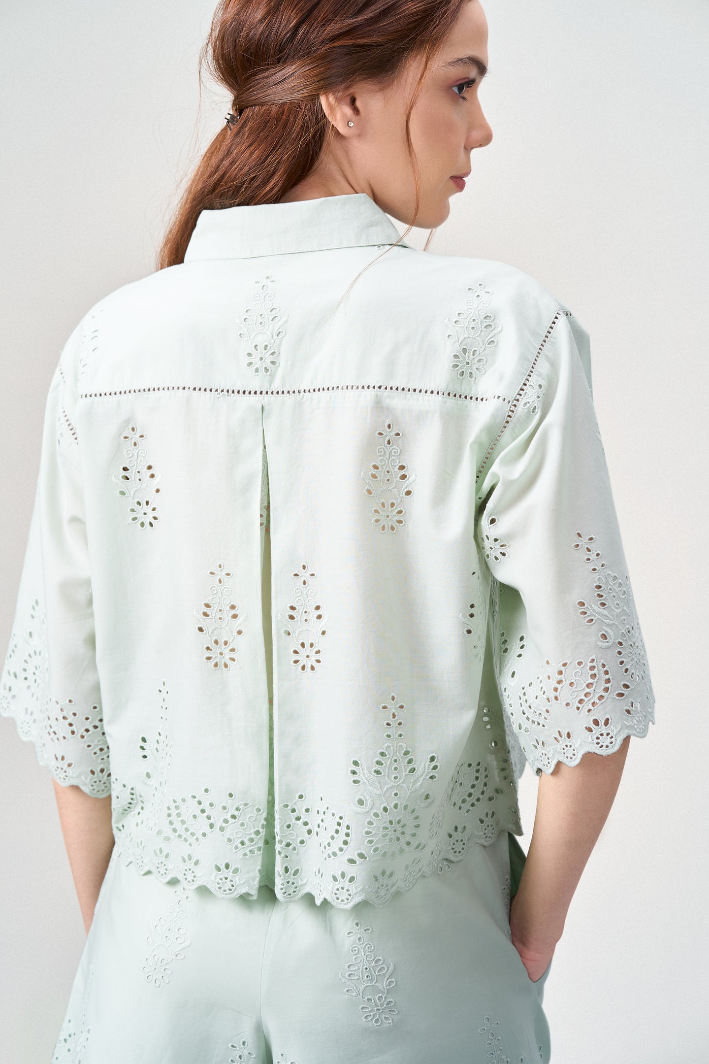Cotton Cutwork Embroidery Scallop Sleeve Hem Green Color Crop Short Sleeve Shirt For Ladies Women Model Back View | Light Green Cotton Eyelet Embroidered Crop Shirt For Women