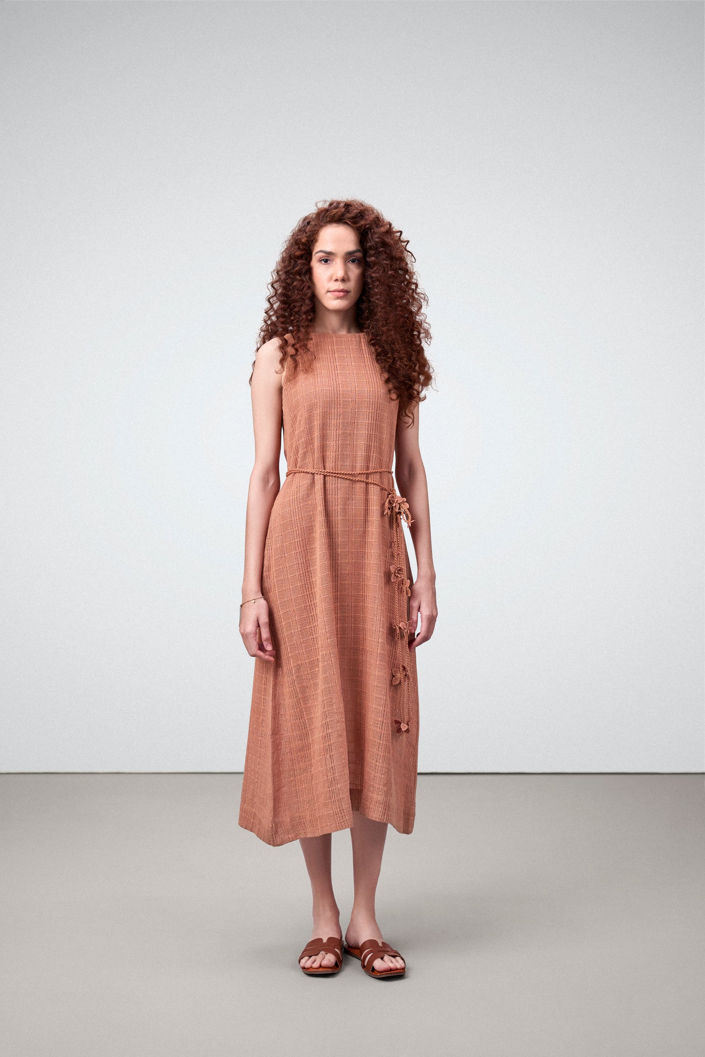 Cotton Guipure Sleeveless Round Neckline Floral Accents Bloom Midi Dress For Women Ladies Terracotta Color Model Front View | Terracotta Guipure Bloom Midi Dress | Cotton Midi Dress For Women