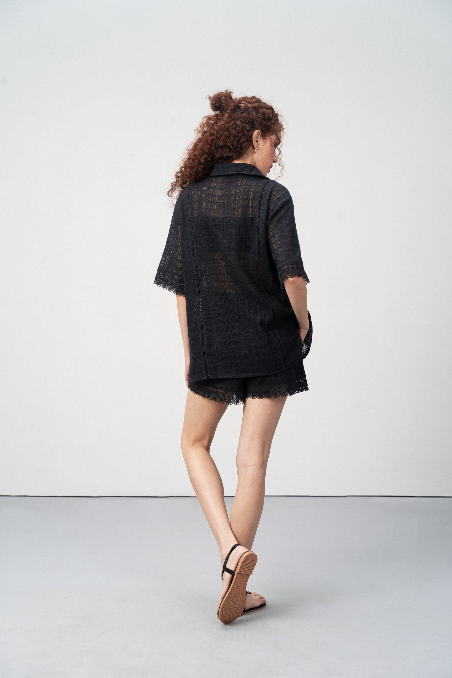 Cotton High Waist Lace Trim Cotton Relaxed Stylish Fit Elastic Waistband Shorts For Women Ladies Black Color Back Model View | Women’s High Waist Black Cotton Shorts With Lace Trim