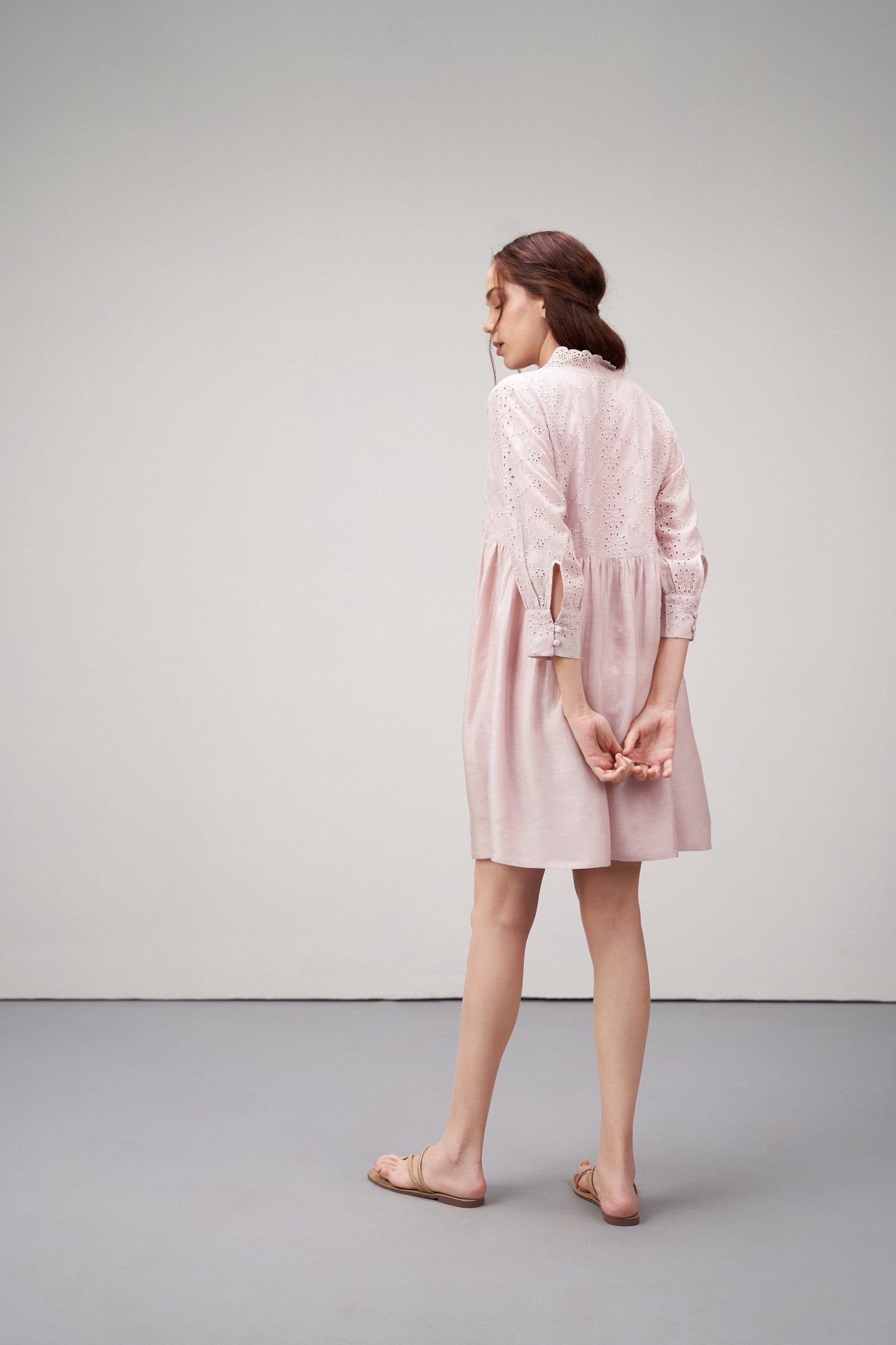 Women's Premium Linen Cotton Pink Embroidered Cutwork V-neck Mini Dress | Broidery Anglaise Short Dress For Left Back Side Model View