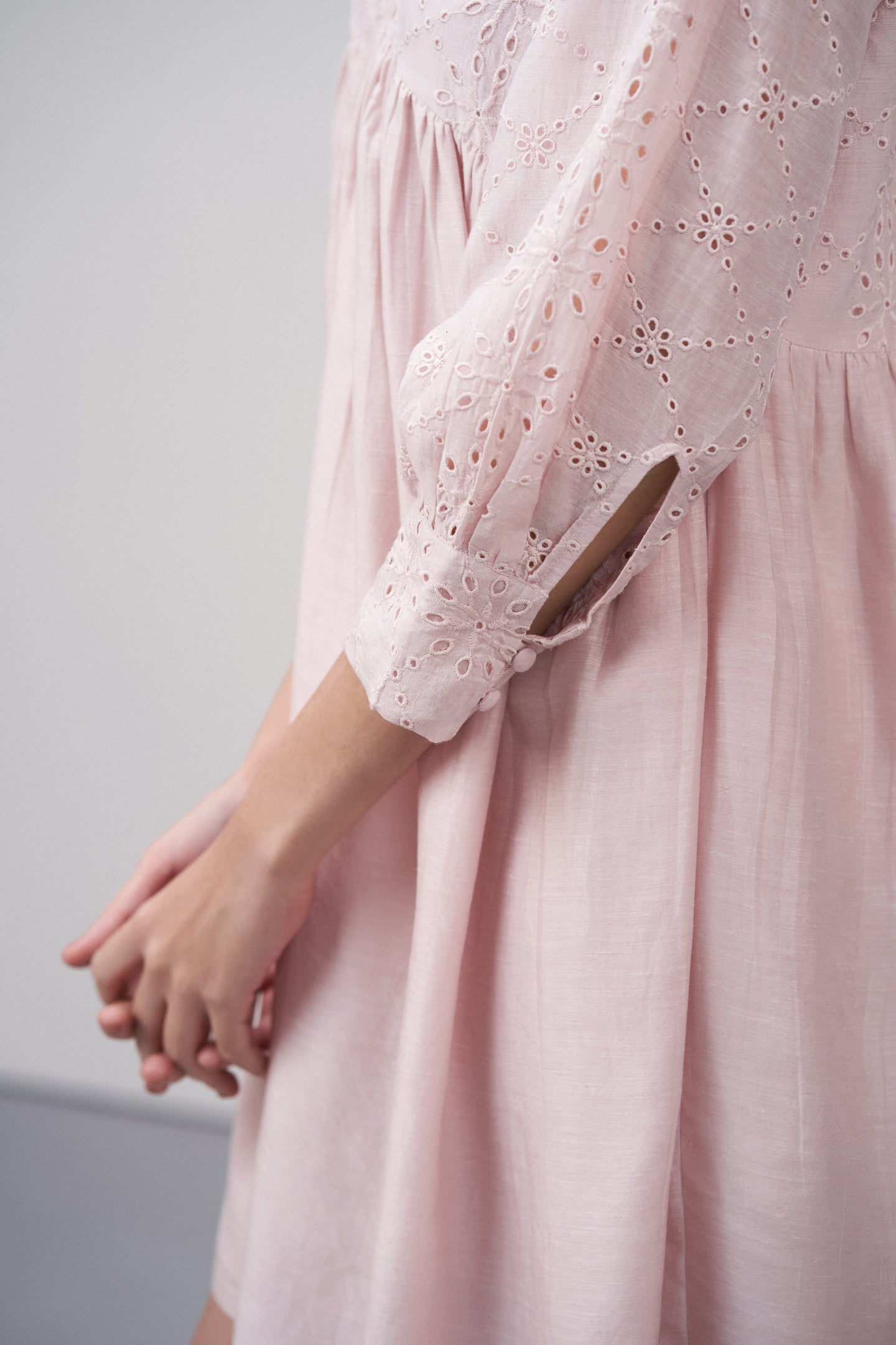 Women's Premium Linen Cotton Pink Embroidered Cutwork V-neck Mini Dress | Broidery Anglaise Short Dress For Left Side Model View