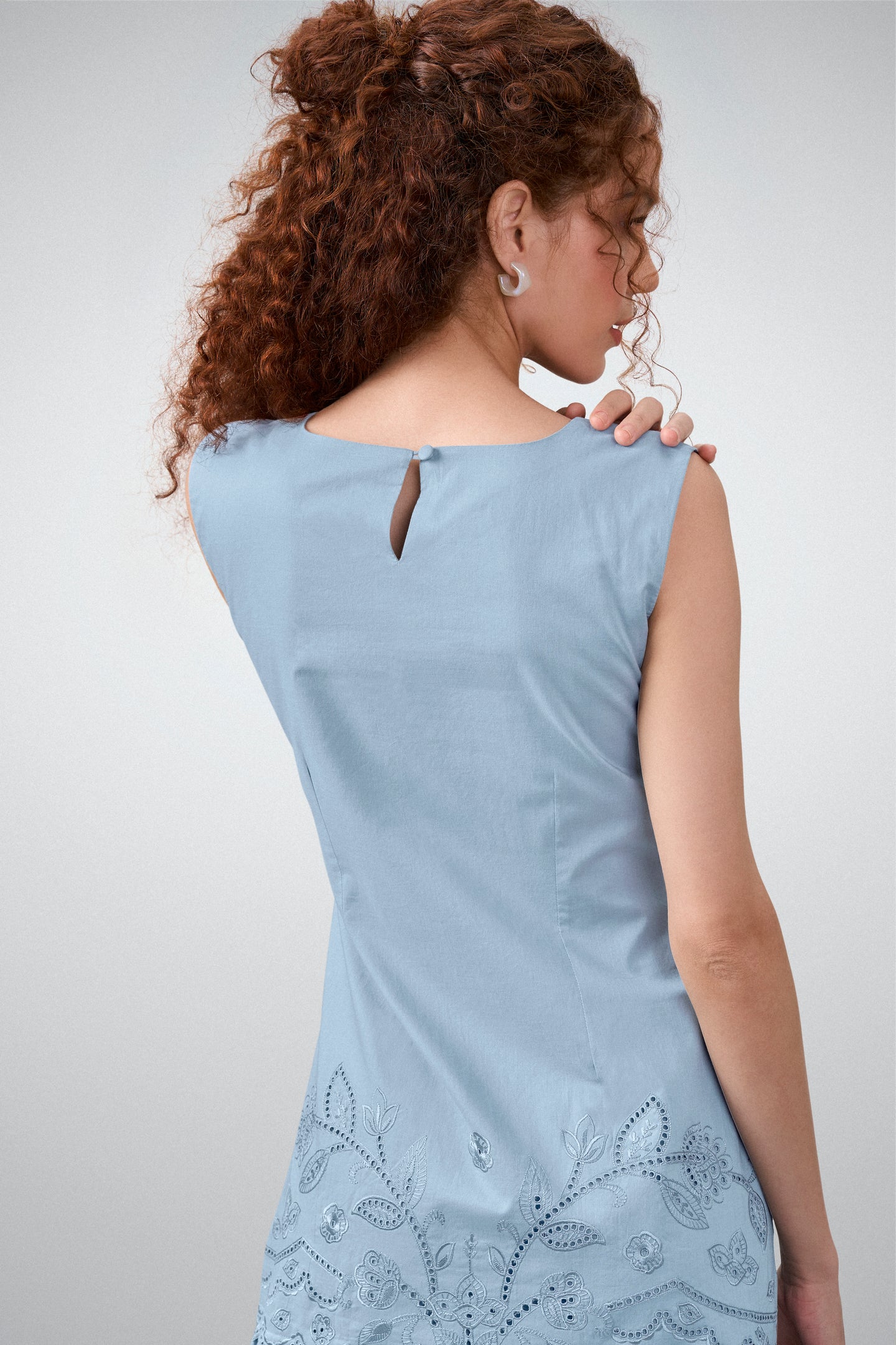 Cotton Round Neckline Sleeveless Embroidered Hem Short Dress For Women Ladies Relaxed Fit Blue Color Model Back View | Blue Cotton Sleeveless Mini Dress With Embroidered Hem
