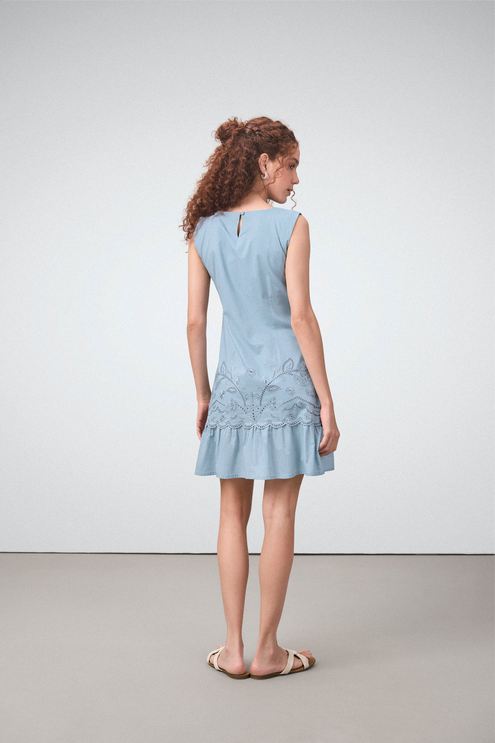Cotton Round Neckline Sleeveless Embroidered Hem Short Dress For Women Ladies Relaxed Fit Blue Color Model Back View | Blue Cotton Sleeveless Mini Dress With Embroidered Hem