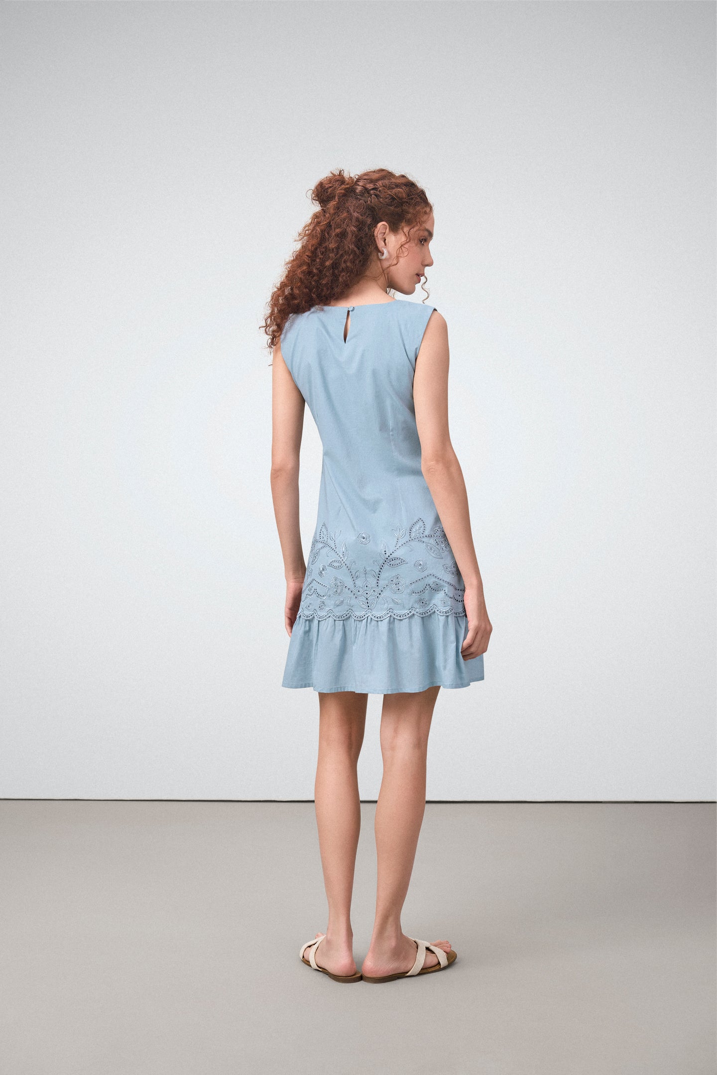 Cotton Round Neckline Sleeveless Embroidered Hem Short Dress For Women Ladies Relaxed Fit Blue Color Model Back View | Blue Cotton Sleeveless Mini Dress With Embroidered Hem
