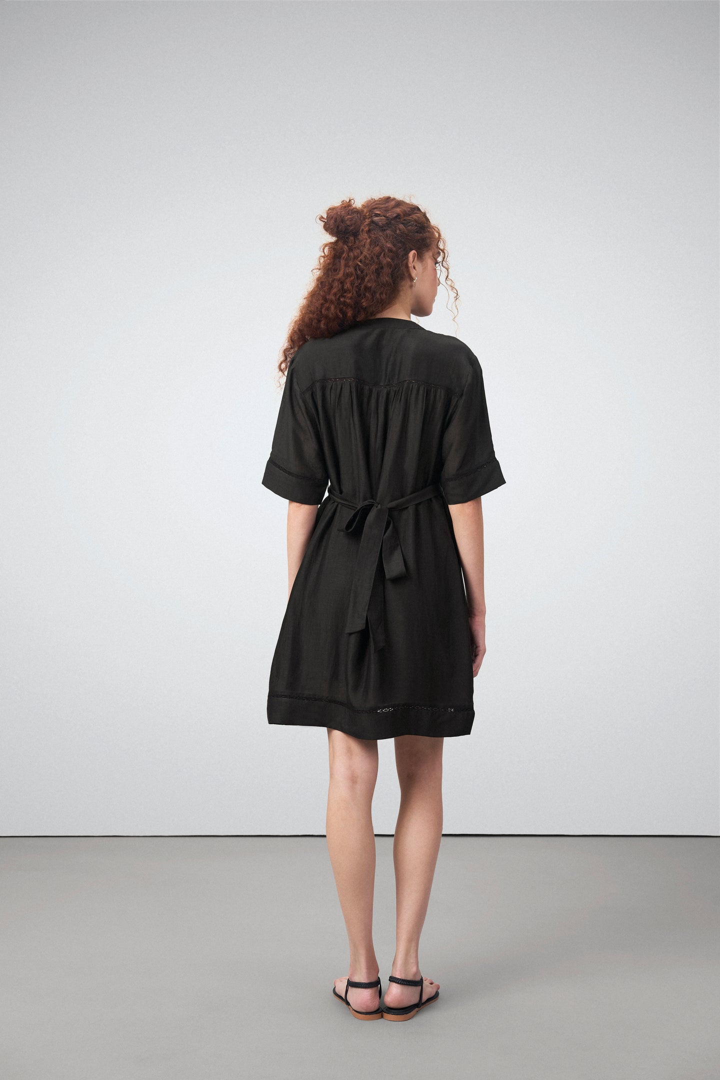 Linen Half Sleeves Adjustable Side Tie Belt Button Front Short Dress For Women Ladies Black Color Back View | Black Linen Blend Relaxed Fit Dress With Mandarin Collar