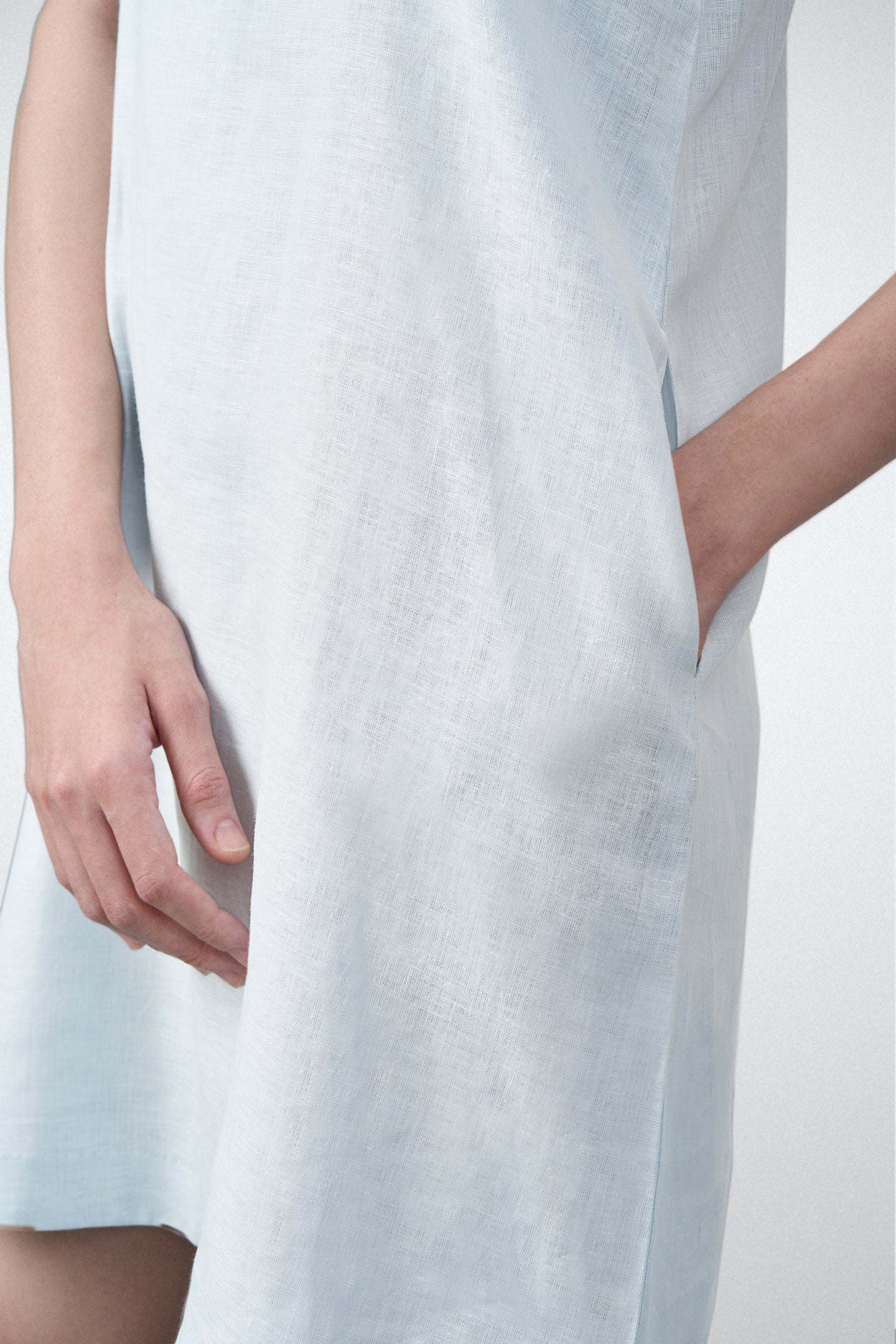 Women Ladies Linen Sleeveless Short Mini Dress Light Blue Color Side Pocket View | Women’s Linen Boat Neck Sleeveless Mini Dress | Front Side View Linen Shift Dress