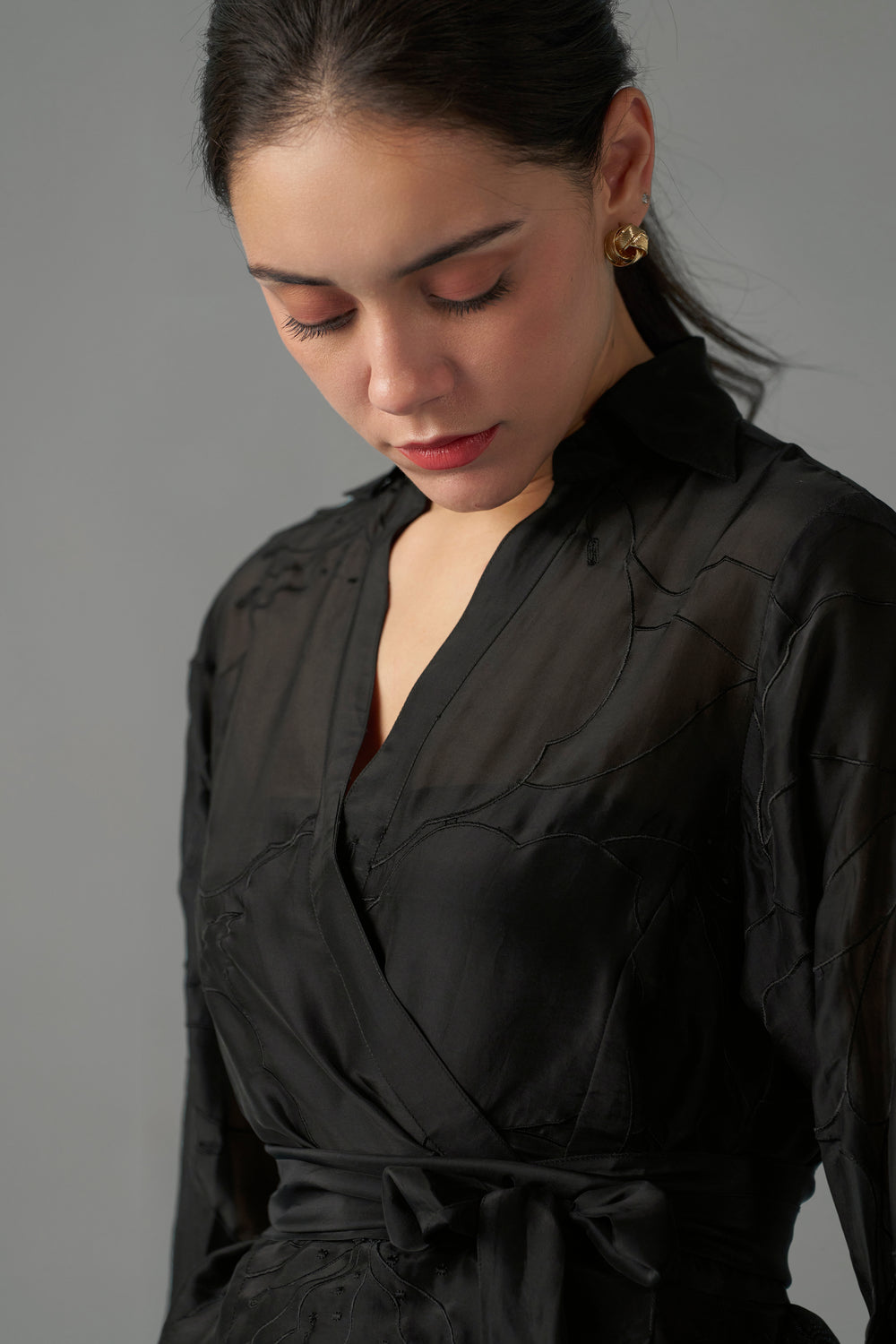 Women Black Embroidered Blouse With Tie-Up Top neckside design view | Embroidered Tops for Women
