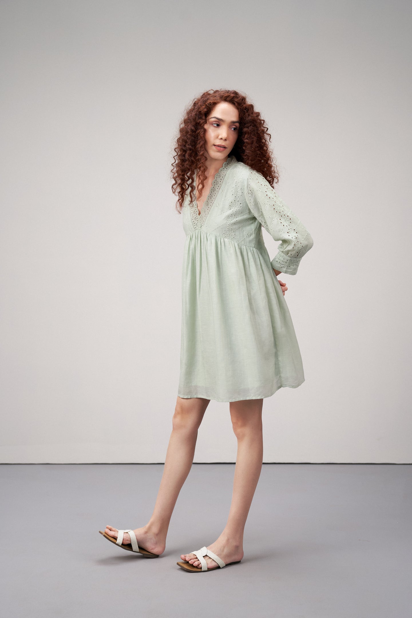 Linen Cutwork Embroidery Long Sleeves V Neckline Scalloped Edge Lightweight Mini Short Dress For Women Ladies Light Green Color Side Model View | Women's Premium Linen Cotton Green Embroidered Cutwork V-neck Mini Dress | Broidery Anglaise Short Dress 
