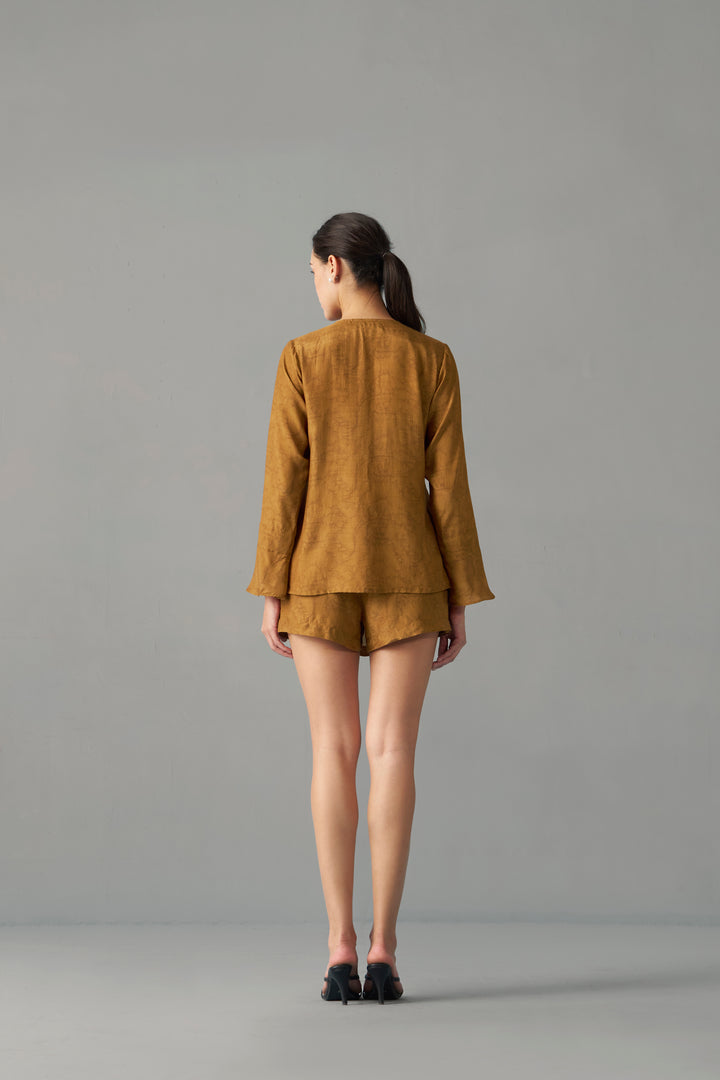 Model Wearing Mustard Printed Wrap Skorts for Women by House of Sava , Person wearing a mustard yellow outfit against a gray background