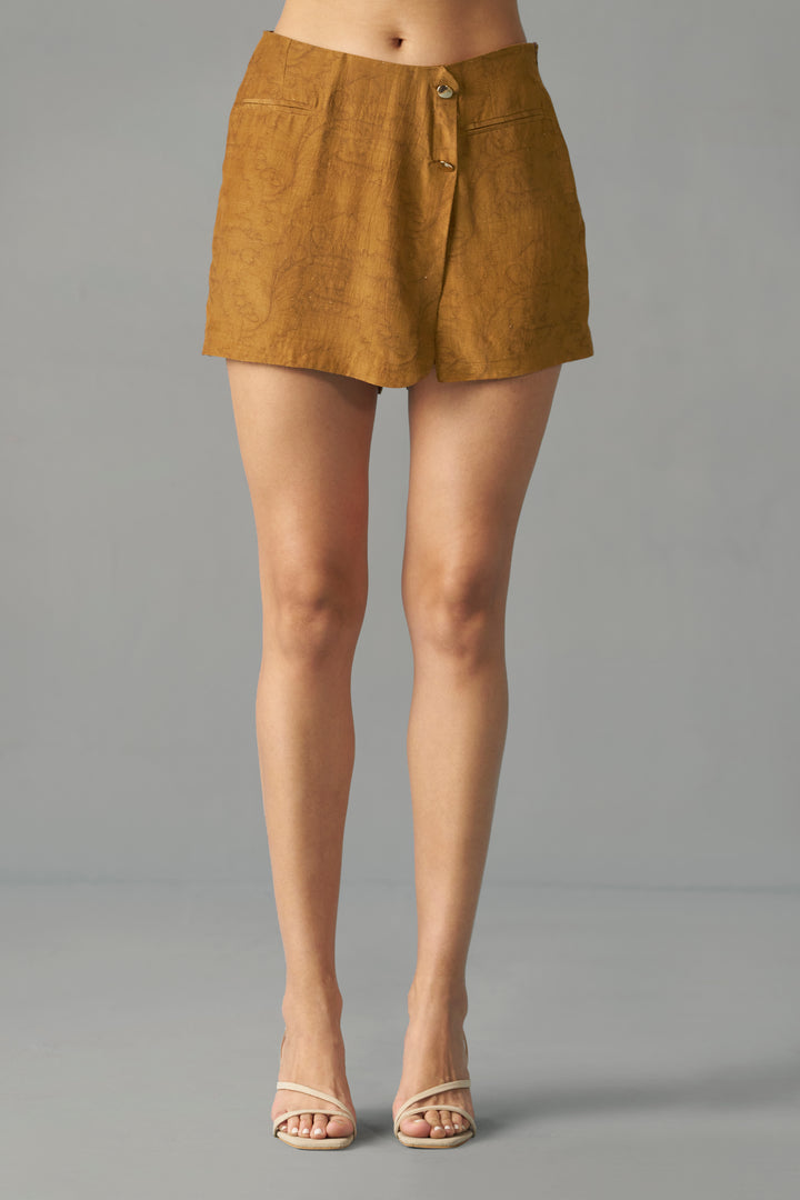 Mustard Printed Wrap Skorts for Women by House of Sava, Person wearing a mustard yellow skirt on a gray background