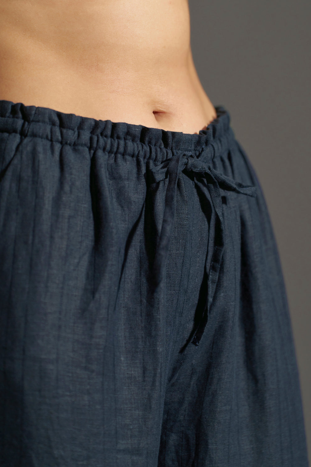 Navy Blue relaxed fit elastic trousers for women | frontside elastic view