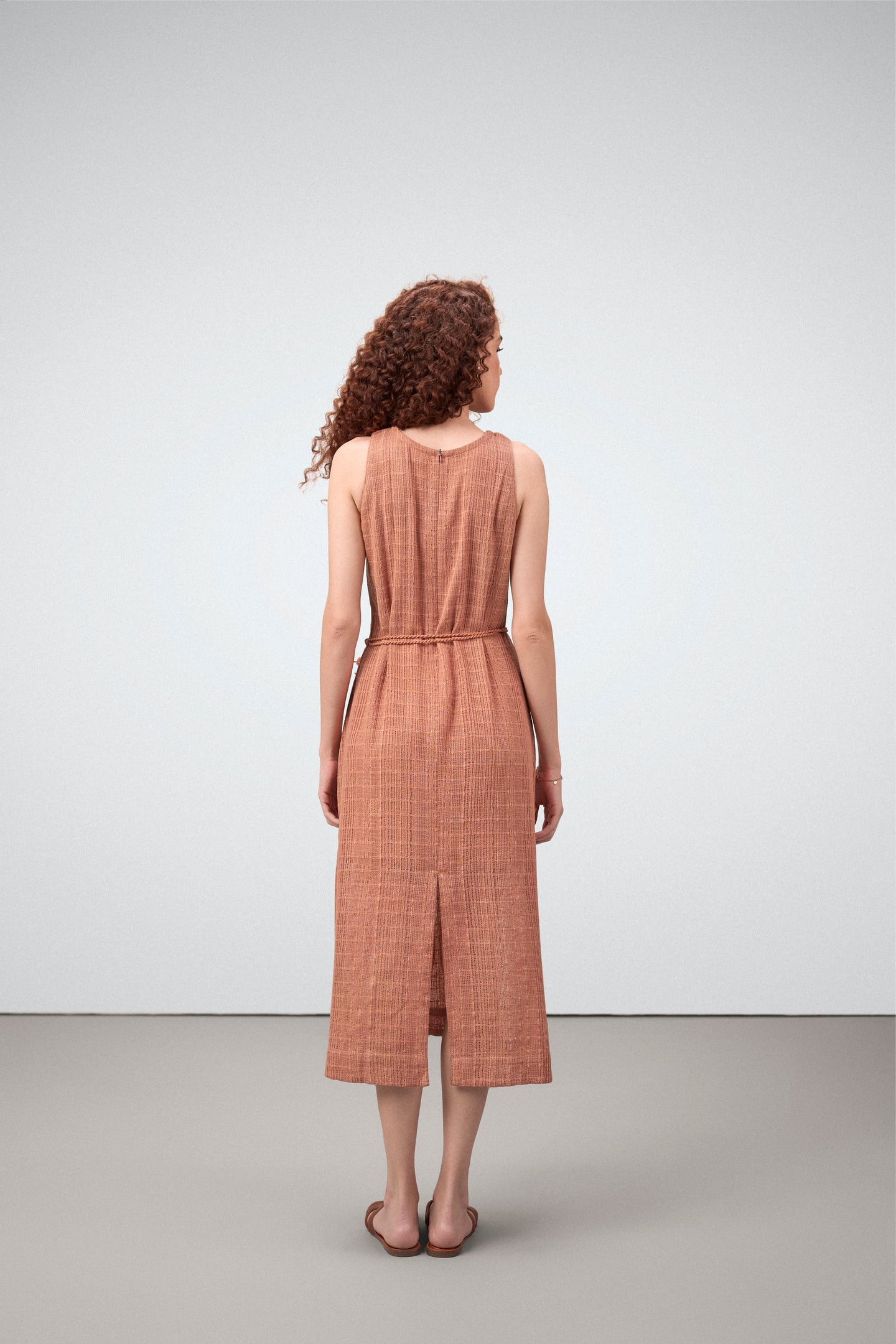 Cotton Guipure Sleeveless Round Neckline Floral Accents Bloom Midi Dress For Women Ladies Terracotta Color Model Back View | Terracotta Guipure Bloom Midi Dress | Cotton Midi Dress For Women
