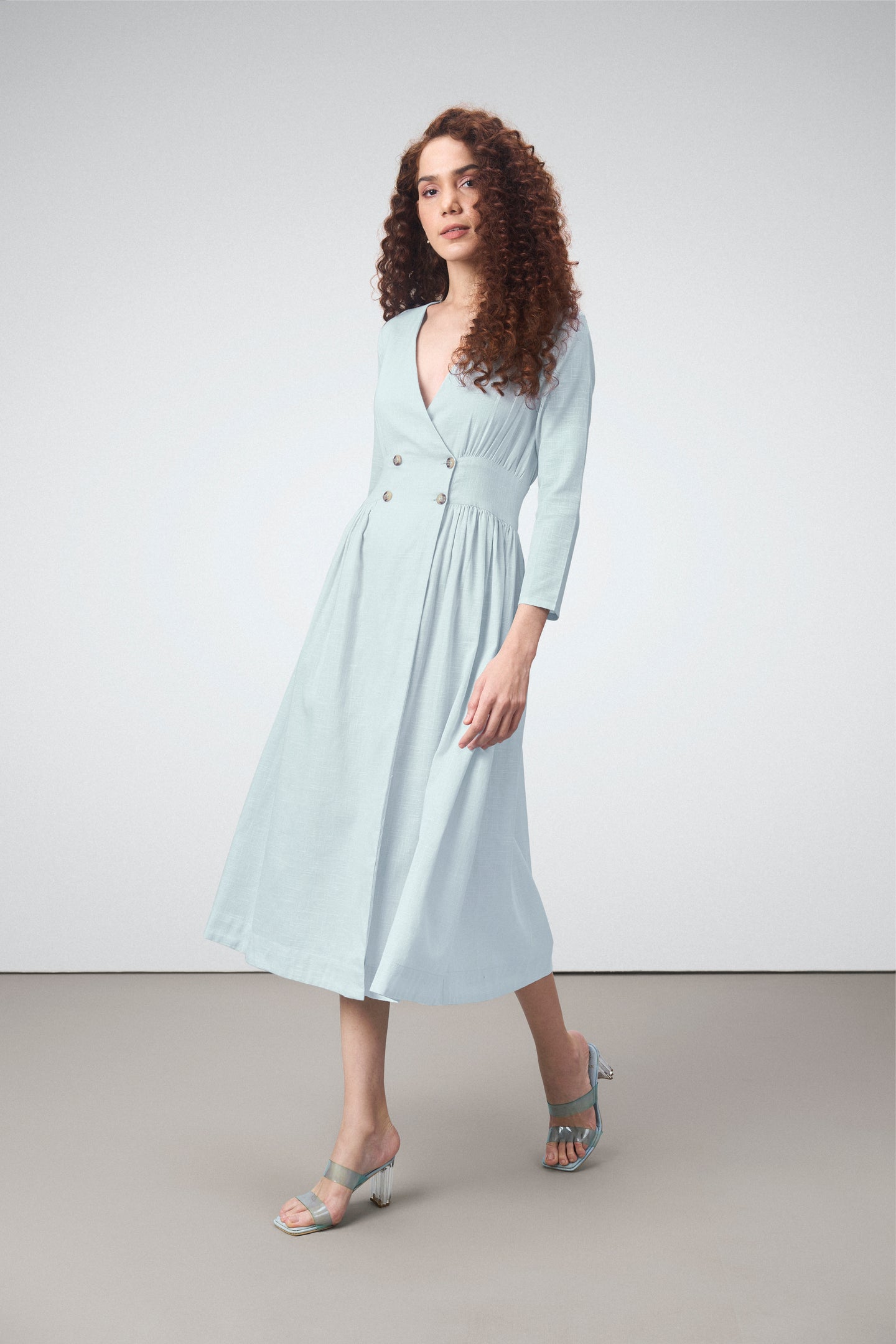 Ladies 100% Cotton Soft And Breathable Long Sleeve V Neckline Blue Color Fit And Flare Midi Dress For Women Model Side View | Blue Cotton Fit & Flare Midi Dress For Women
