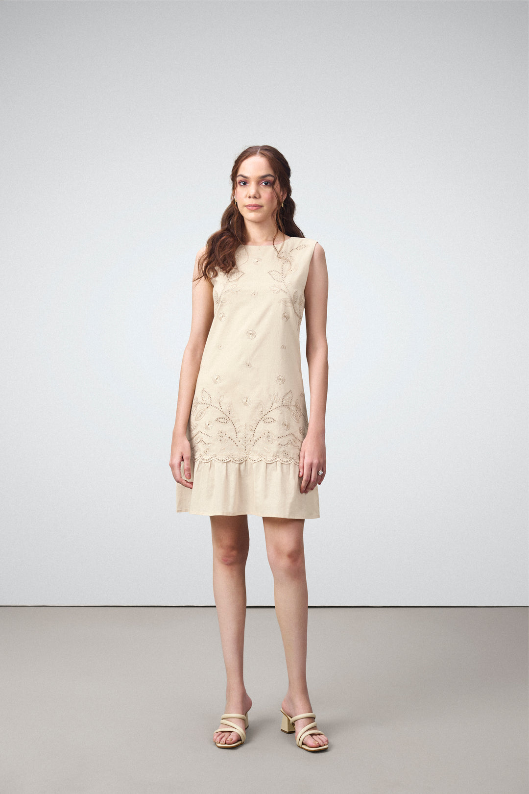 Cotton Round Neckline Sleeveless Embroidered Hem Short Dress For Women Ladies Relaxed Fit Beige Color Model Front View | Blue Cotton Sleeveless Mini Dress With Embroidered Hem
