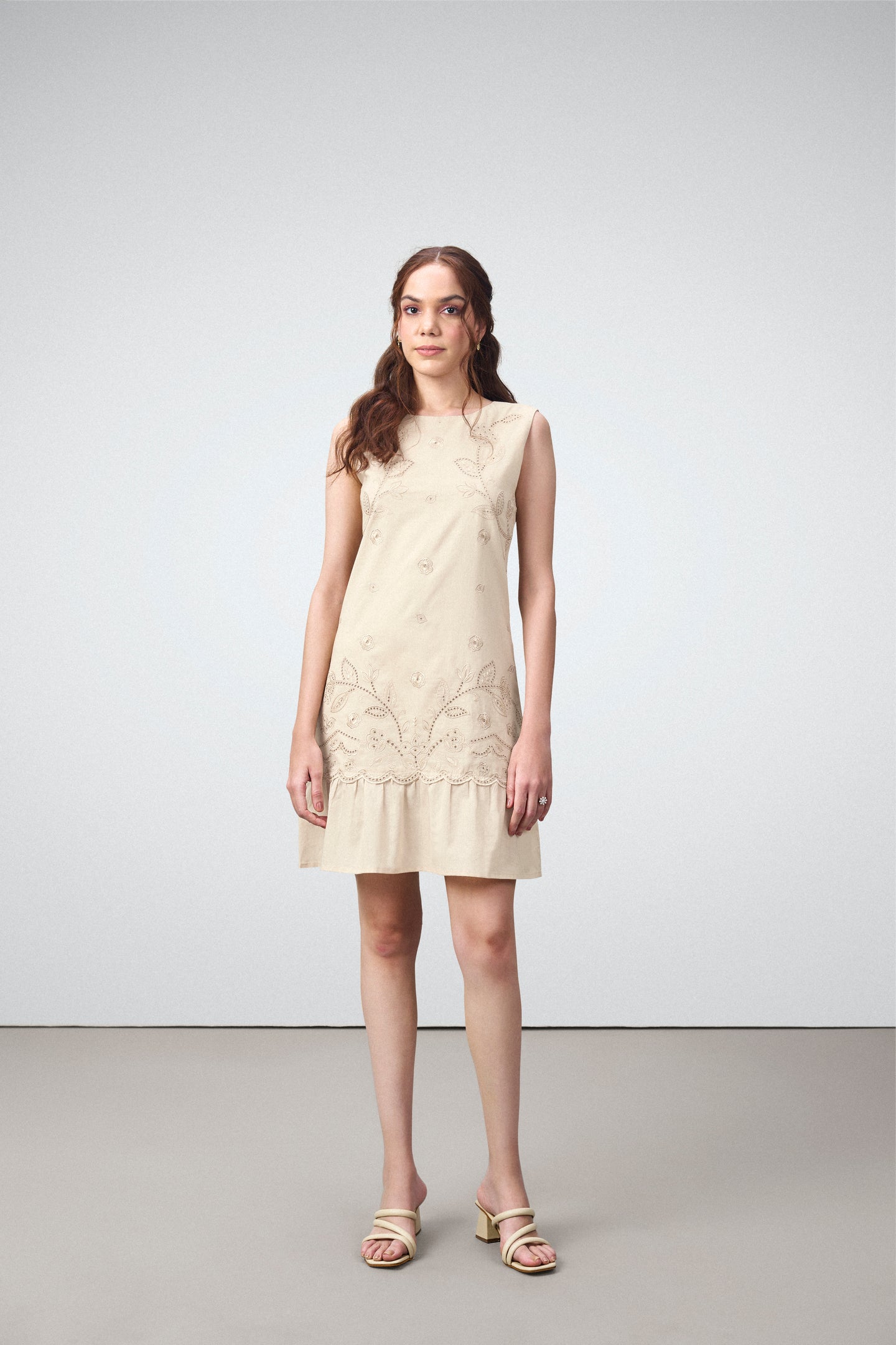 Cotton Round Neckline Sleeveless Embroidered Hem Short Dress For Women Ladies Relaxed Fit Beige Color Model Front View | Blue Cotton Sleeveless Mini Dress With Embroidered Hem

