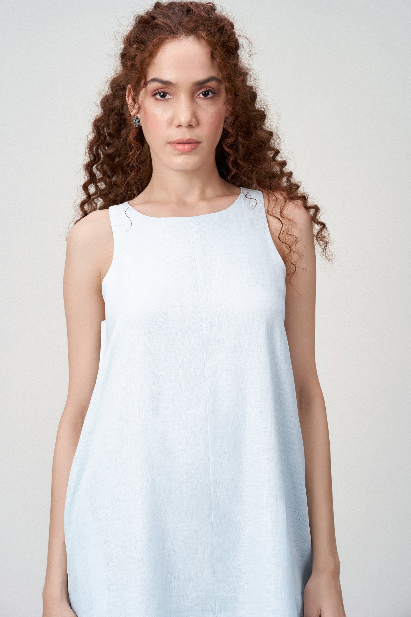 Women Ladies Linen Sleeveless Short Mini Dress Light Blue Color Model Front View Close | Women’s Linen Boat Neck Sleeveless Mini Dress | Front Side View Linen Shift Dress